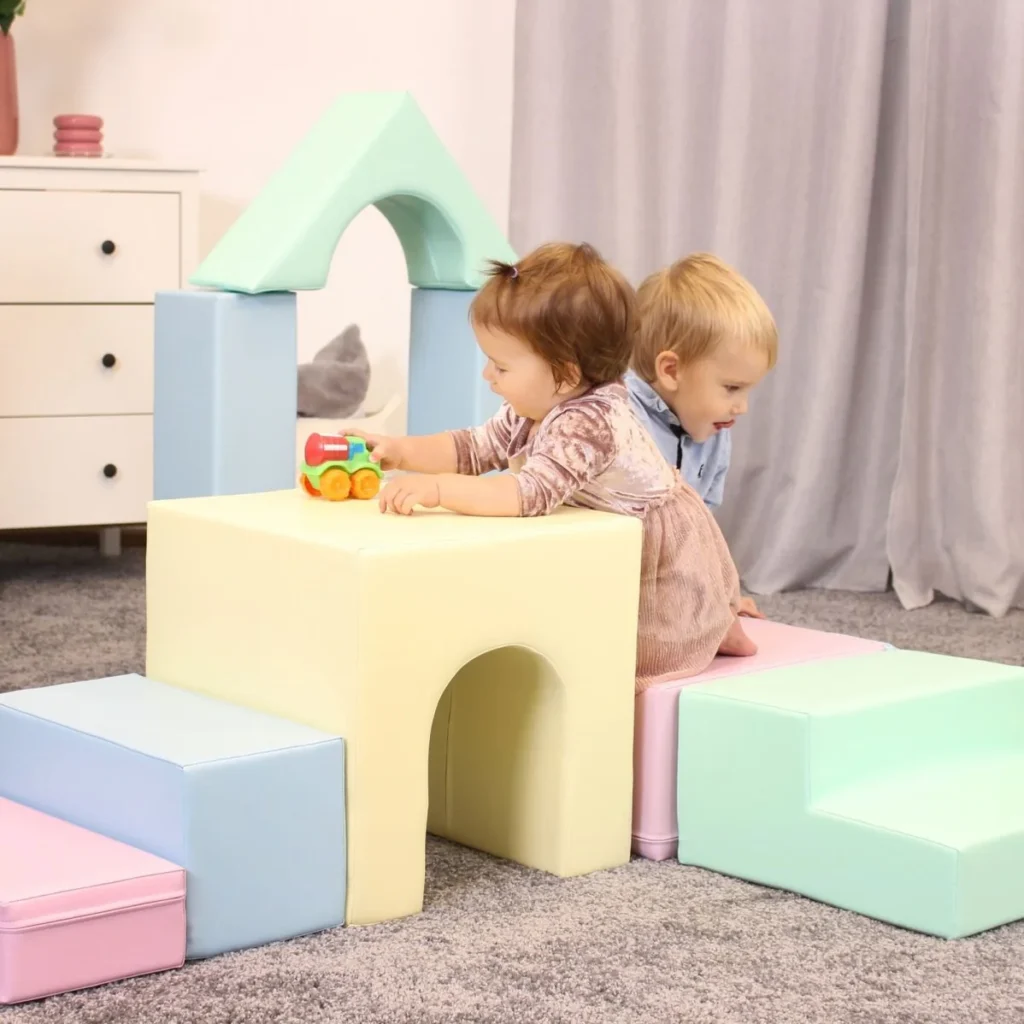 children stacking soft play blocks